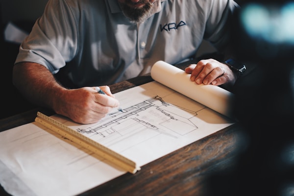 Architect drawing blueprints